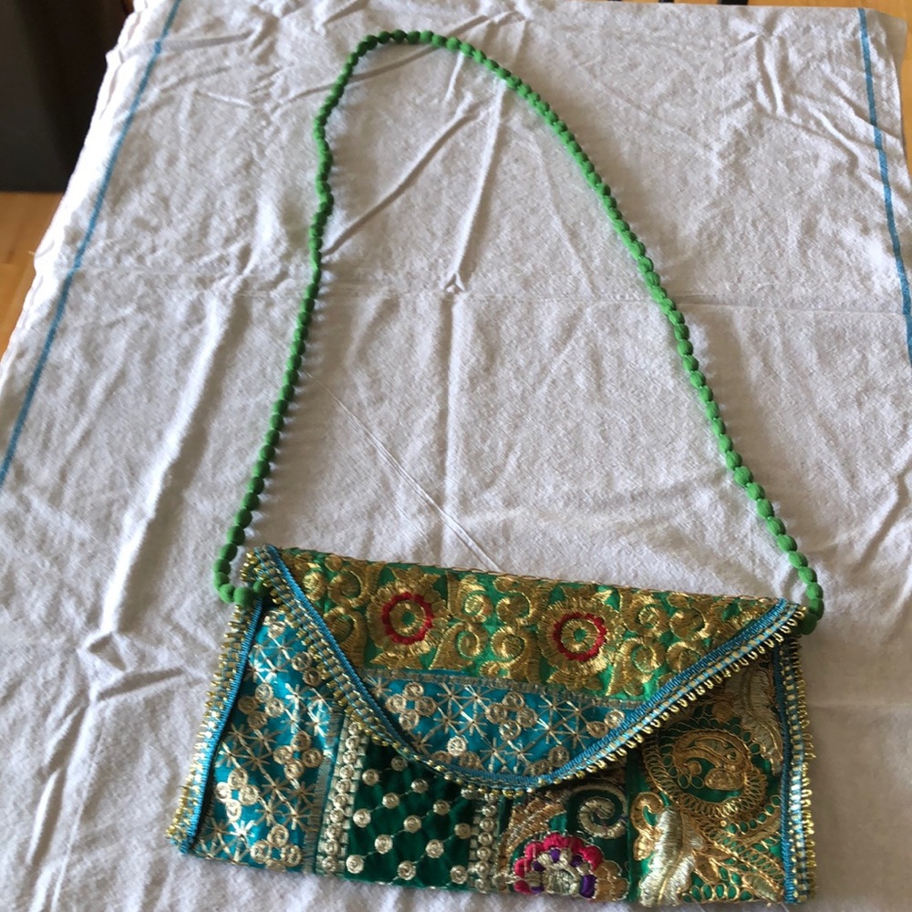 Gold green blue fabric purse.